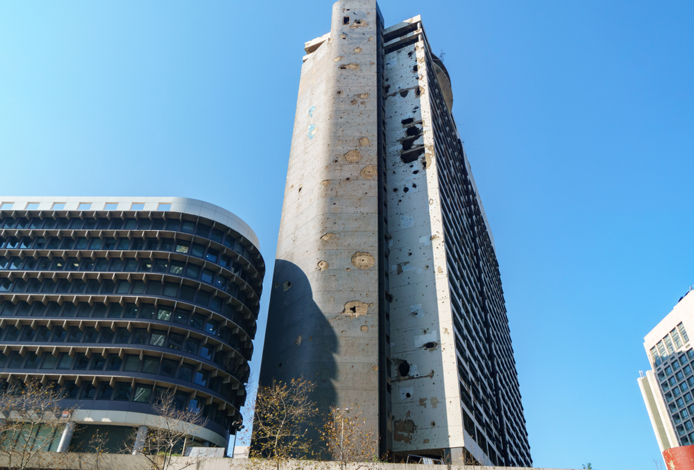 The Holiday Inn in Beirut with holes in the walls caused by bullets and shells