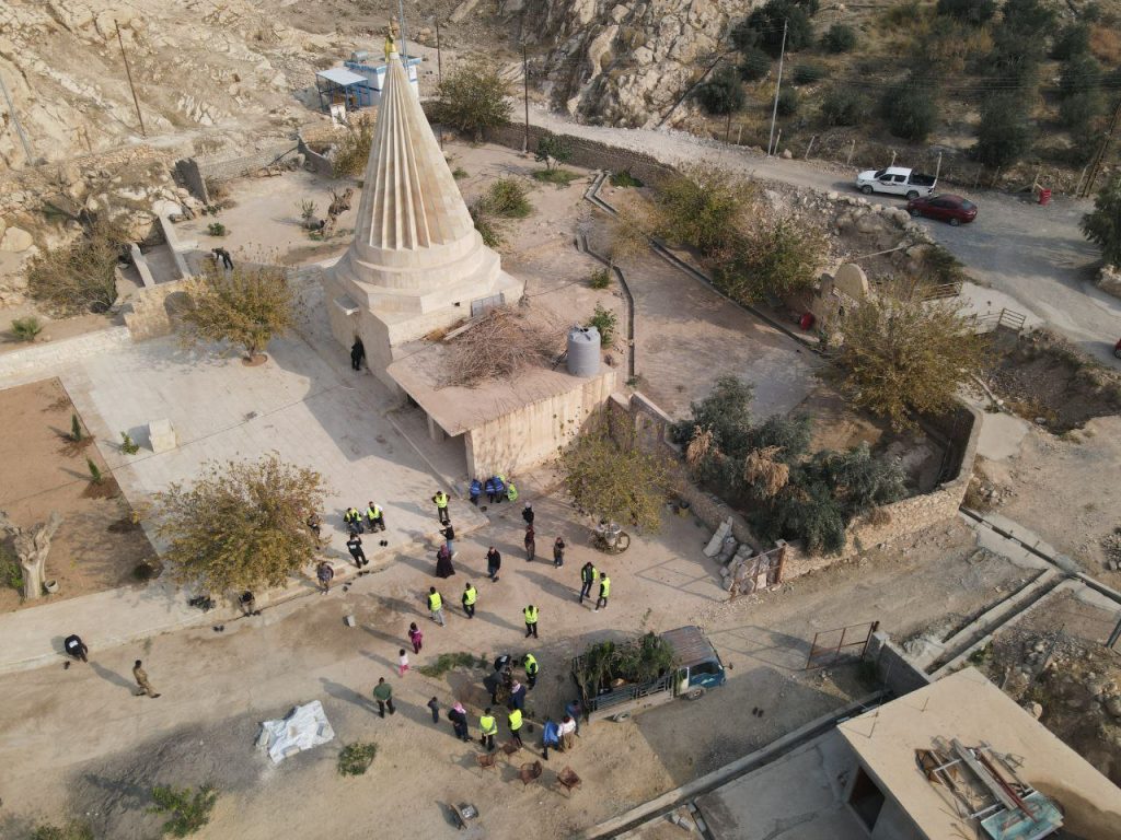 Muslim volunteers from Mosul plant trees at the Yazidi Shrine in Bashiqa as part of the Green Mosul Project.